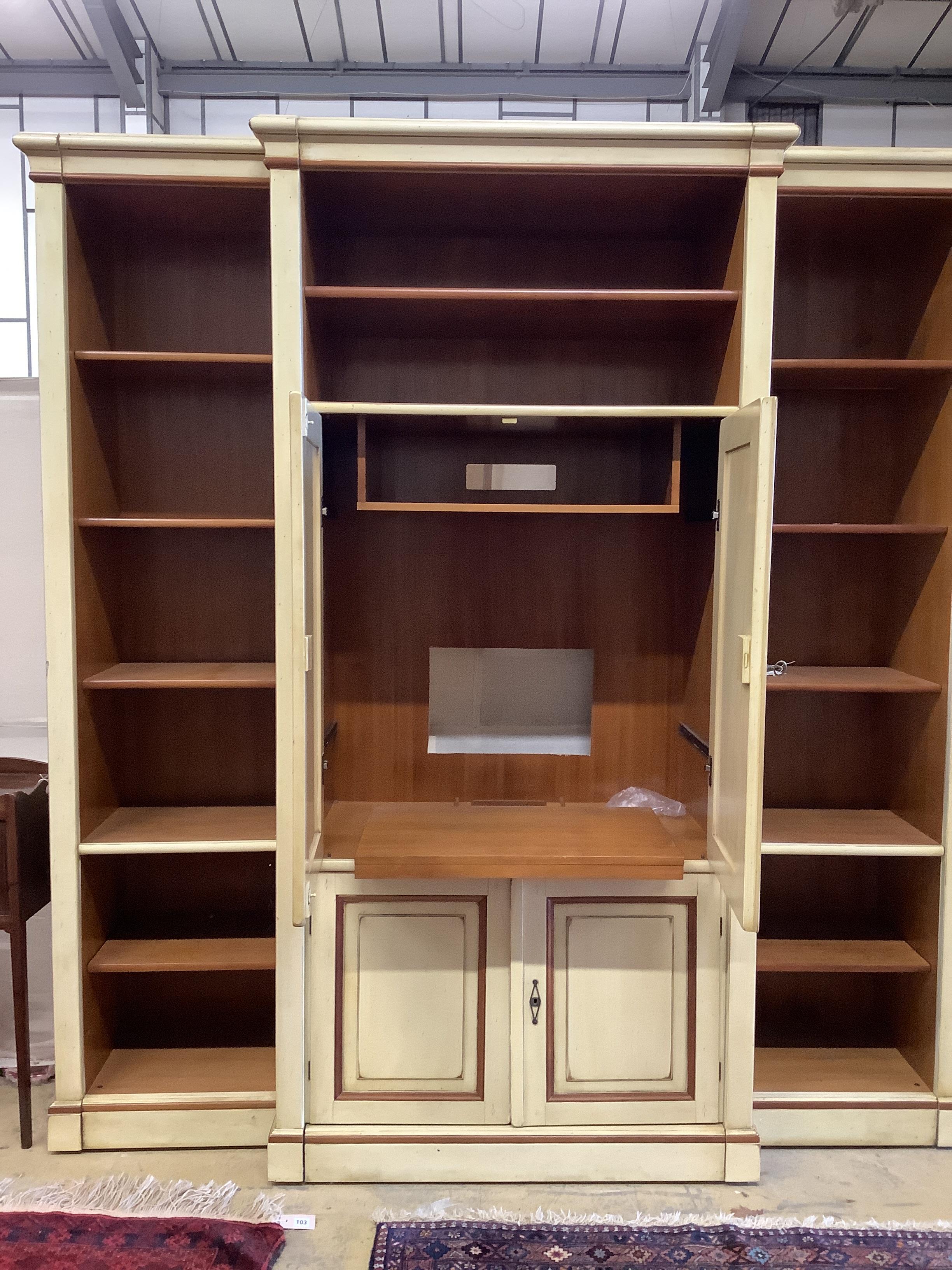 A reproduction Continental painted breakfront bookcase / media cabinet, width 204cm, depth 55cm, height 222cm